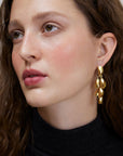 Wouters & Hendrix - Stud Earrings with Dangling Mussels in Gold