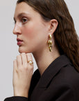 Wouters & Hendrix - Stud Earrings with Dangling Mussels in Gold