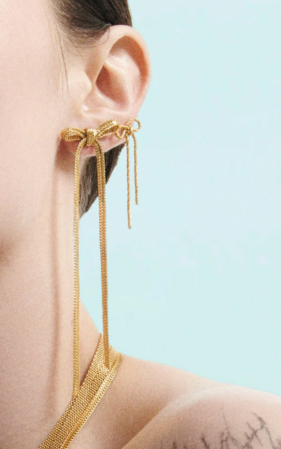 Wouters & Hendrix - Long Bow Earrings in Gold