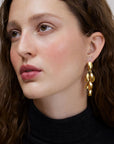 Wouters & Hendrix - Stud Earrings with Dangling Mussels in Gold