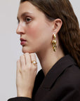 Wouters & Hendrix - Stud Earrings with Dangling Mussels in Gold