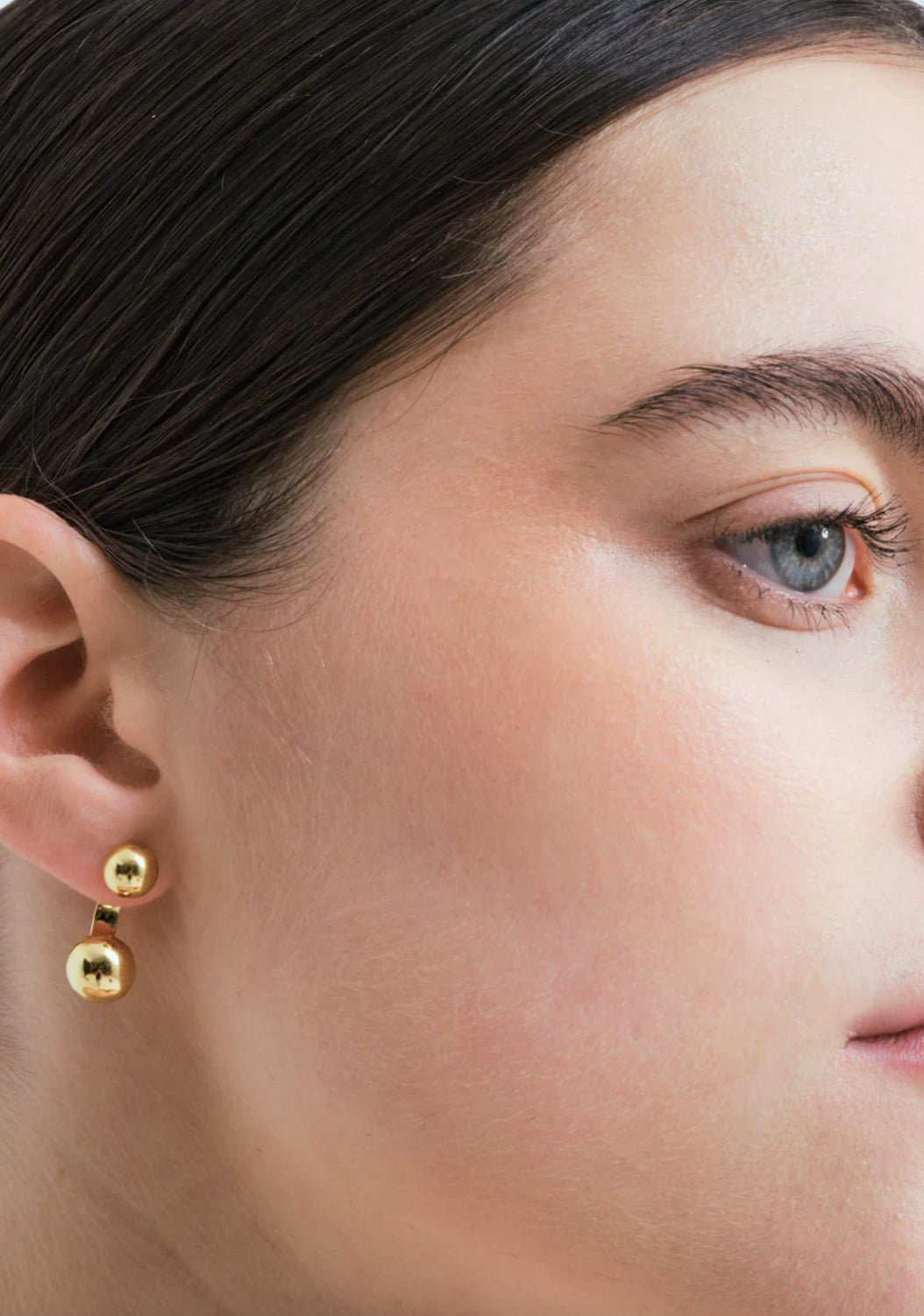 Wouters & Hendrix - Stud Earrings with Floating Spheres in GOLD