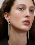Wouters & Hendrix - Statement Stud Earrings with Crystal Flower and Entangled Flowing Chains in Silver