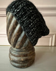 KARAKORAM - Knitted Slant Beanie in Black Mix